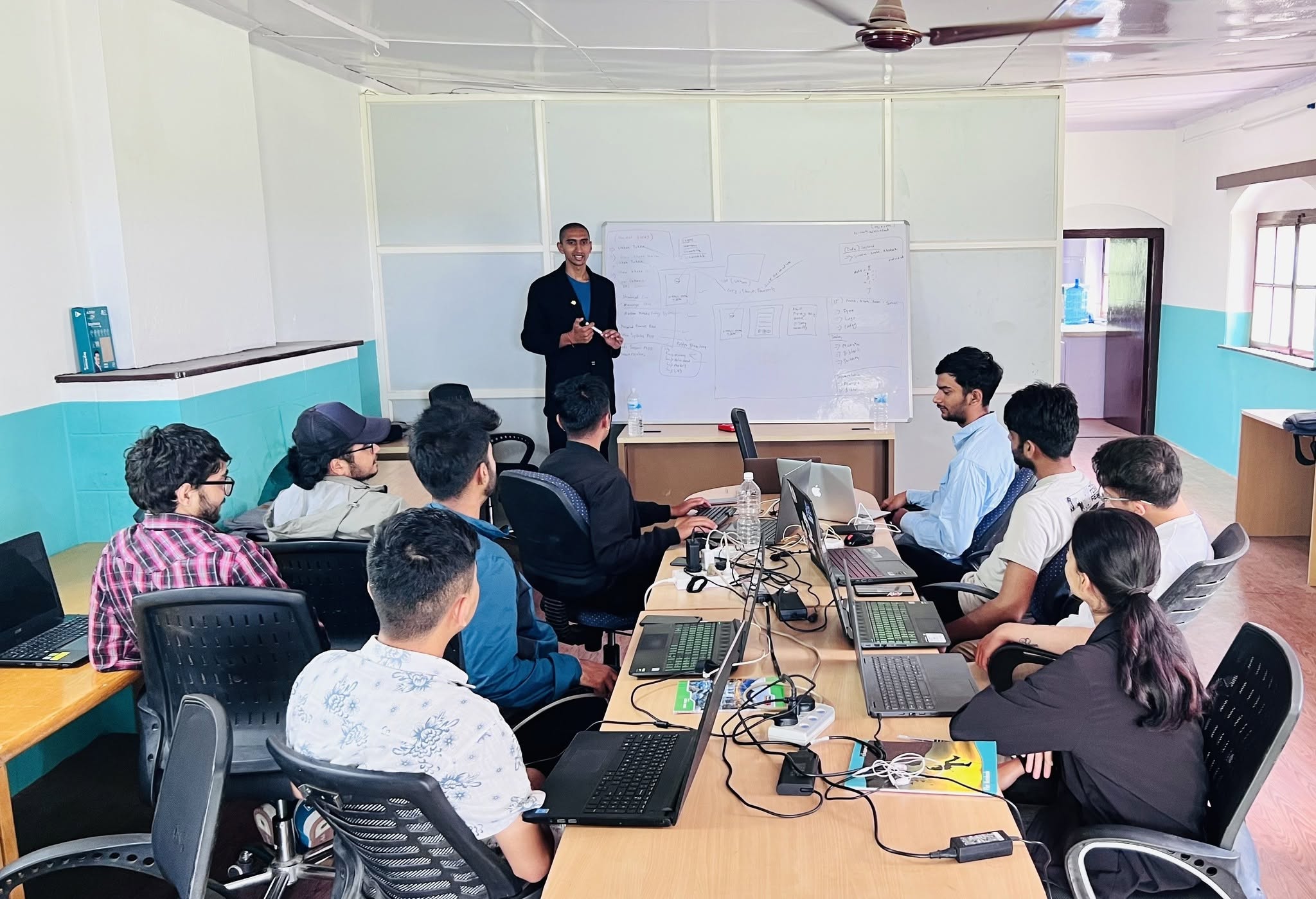 Bishworaj Poudel leading an IT training session at a whiteboard at Mahabir Pun Innovation Centre